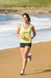 Photo: Woman running on beach Woman running on beach