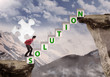 Photo: Businessman bring puzzle solution to mountain top Businessman bring puzzle solution to mountain top