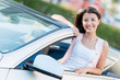 Foto: Woman in a convertible car Woman in a convertible car