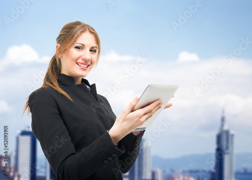 Photo: Woman using a digital tablet Woman using a digital tablet