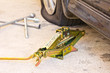 Mechanic sets a jack-screw.
