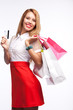 Portrait of woman with shopping bags and card