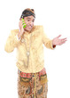 man with traditional java suit using mobile phone