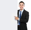 smiling asian business man holding empty board
