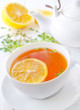 Photo: Fresh tea with lemon in the white cup Fresh tea with lemon in the white cup