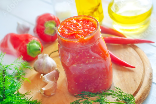 Photo: Fresh chilli sauce in the glass bank Fresh chilli sauce in the glass bank