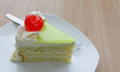 vanilla cake slice and fresh cherry