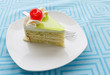 vanilla cake slice and fresh cherry