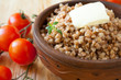 crumbly buckwheat porridge and fresh tomatoes