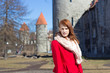 Photo: young woman posing in old town of Tallinn young woman posing in old town of Tallinn