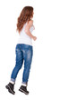 back view of jumping  woman  in  jeans