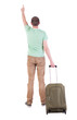 Photo: back view of man with suitcase. back view of man with suitcase.