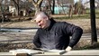 Man stretches after reading books