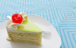 vanilla cake slice and fresh cherry