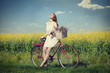 Girl on a bike in the countryside