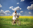 Girl on a bike in the countryside