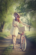 Girl on a bike in the countryside