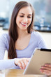 Woman looking at digital tablet