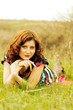 A young girl in a dress and tights posing in spring wood