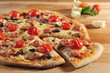 Pepperoni pizza with fresh cherry tomatoes and olives