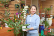 Mature woman with Dendrobium orchid