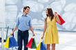 Happy couple after successful shopping