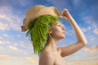 woman in profile with eco hair-style and hat