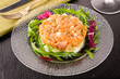 Salmon tartar with salad