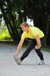 Photo: Young athlete stretching in the park Young athlete stretching in the park