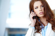 Pretty young business woman  using mobile phone