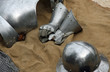 gloves and metal armor with a helmet during the medieval spectac