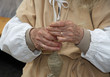 hands of an elderly woman during the processing of wool sweater