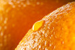 orange background. fruit with drops