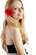 Beautiful young woman with red rose in her hair