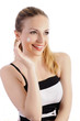 Pretty young woman applying face cream