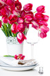 Holiday table setting with pink tulips
