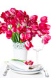 Holiday table setting with pink tulips