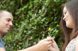 Photo: Guy Giving His Girl a Flower Guy Giving His Girl a Flower
