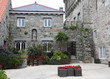 Stone House and Courtyard with planters