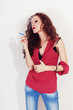 Photo: Smoking young brunette woman with long curly hair Smoking young brunette woman with long curly hair