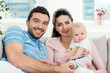 Photo: Happy young family with baby Happy young family with baby