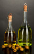 Original glass bottles with oil isolated on black