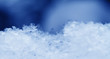 Snowflake in blue snow