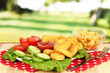 Fried chicken nuggets with french fries,vegetables and sauce