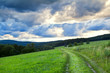 dramatic cloudscape over rural road