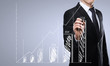 businessman drawing graph