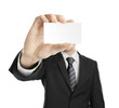 Photo: man handing blank business card man handing blank business card