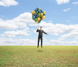 man flying with air baloons