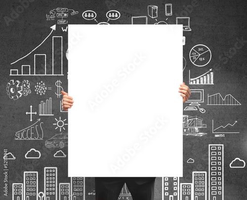 Photo: businessman holding card businessman holding card