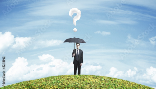 Photo: man standing with umbrella man standing with umbrella